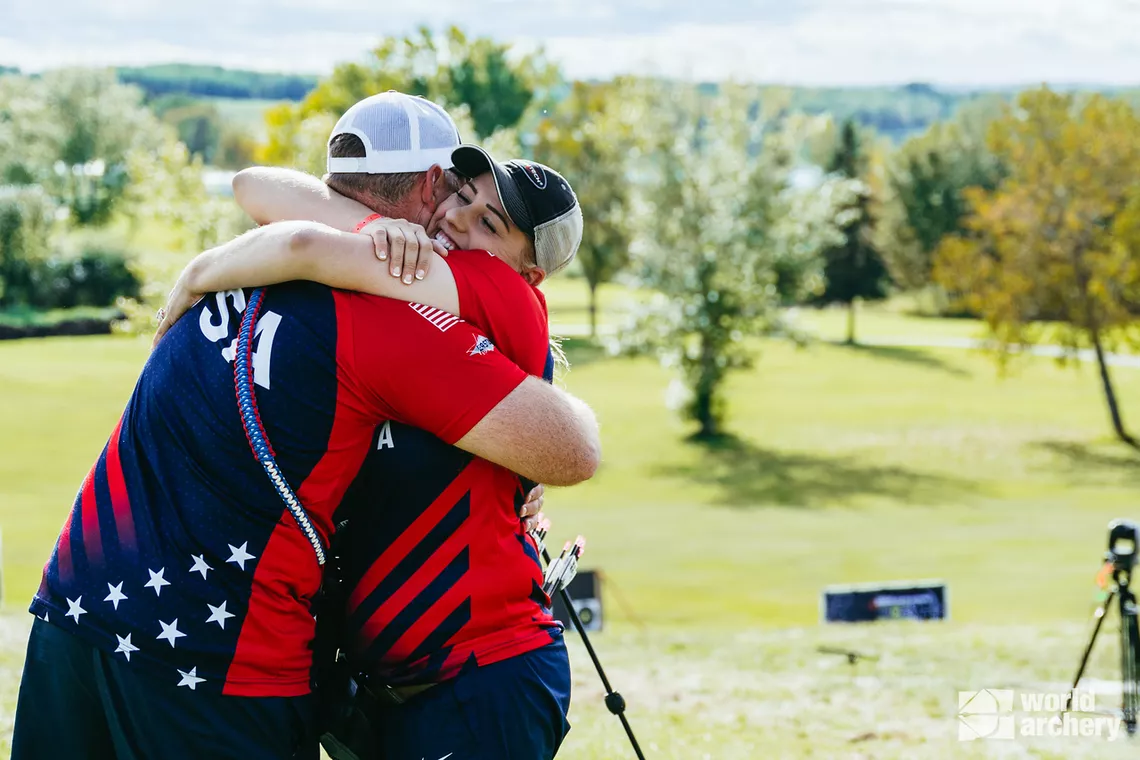 Paige Pearce hugging her coach at Lac La Biche 2024 World Field Championships.