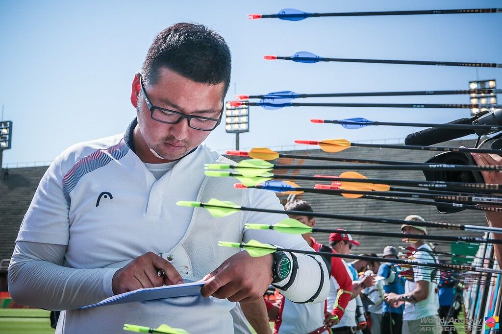 Kim Woojin marks his score at the Rio 2016 Olympic Games. 