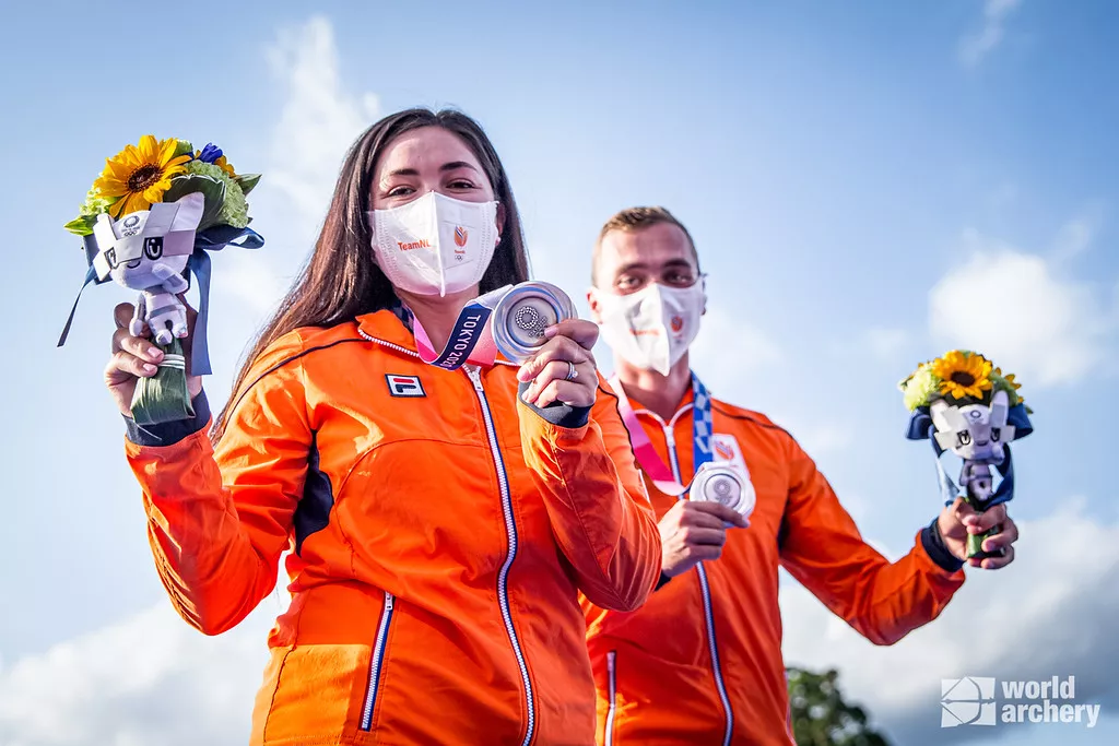 Gaby Schloesser and Steve Wijler celebrate their silver medals in the mixed team event at the Tokyo 2020 Olympic Games. 