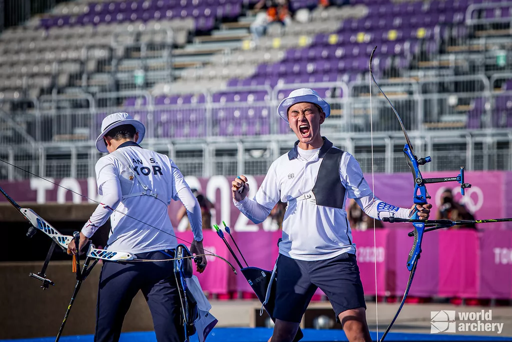 The Korean mixed team celebrates at the Tokyo 2020 Olympics Games. 