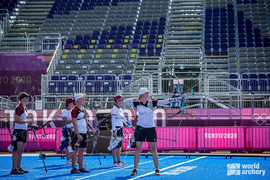 Archers compete in an empty stadium at the Tokyo 2020 Olympic Games. 