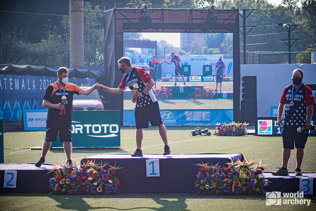 Braden Gellenthien and Mike Schloesser celebrate after the gold medal match of the first stage of the 2021 Hyundai Archery World Cup in Guatemala City.