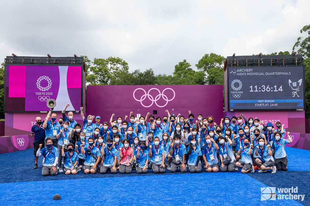 The staff at Yumenoshima Park Archery Field celebrate the completion of a successful Olympics. 