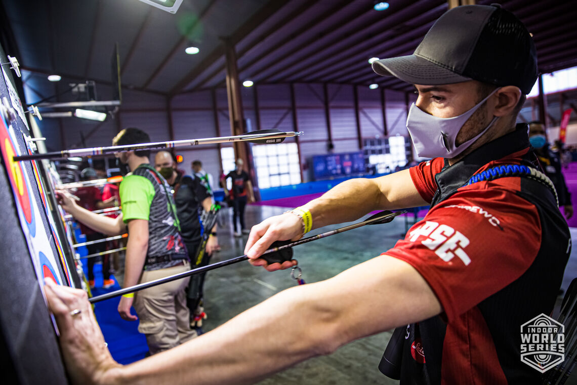 Seb Peineau pulls arrows from the target during qualification at the Sud de France – Nimes Archery Tournament in 2021.