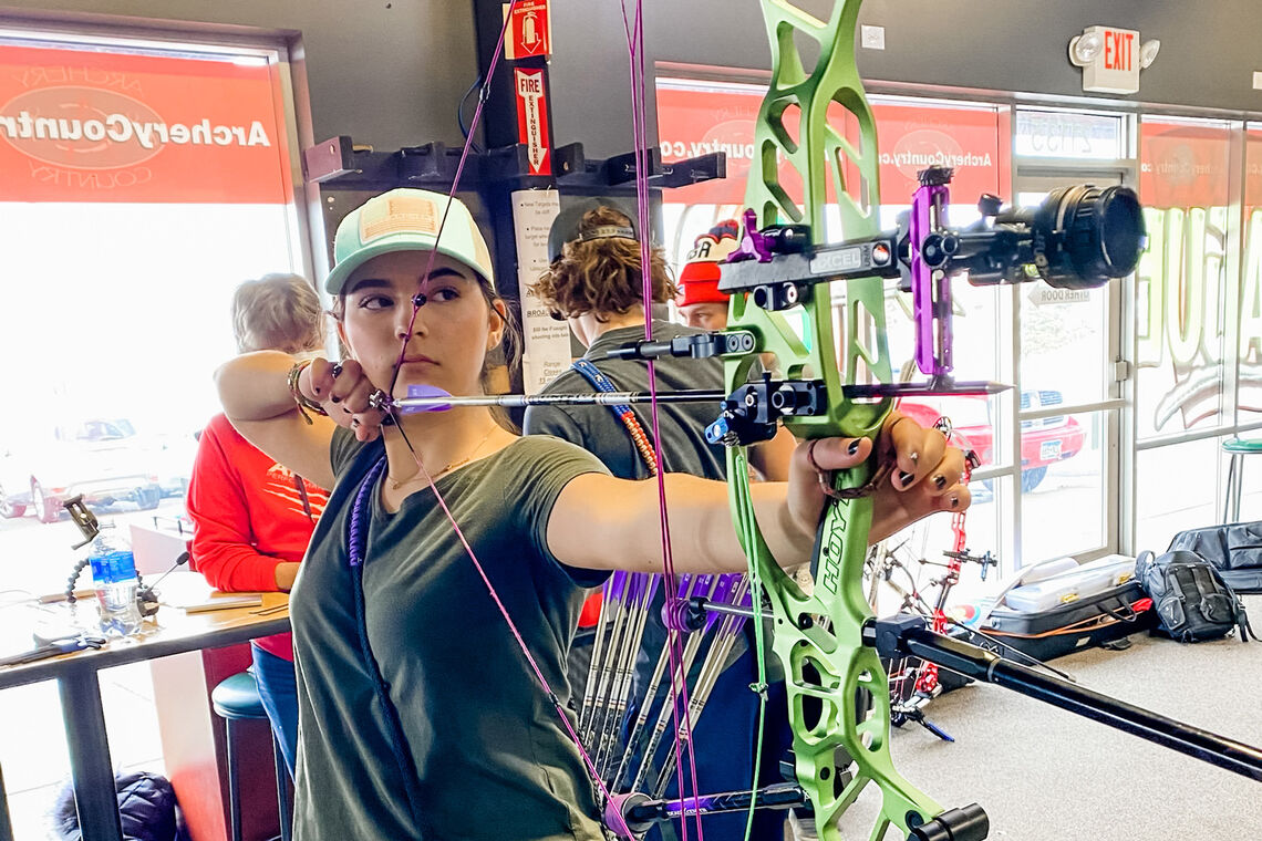 Brielle Ochnich shoots during practice for the Indoor Archery World Series Finals in 2021.