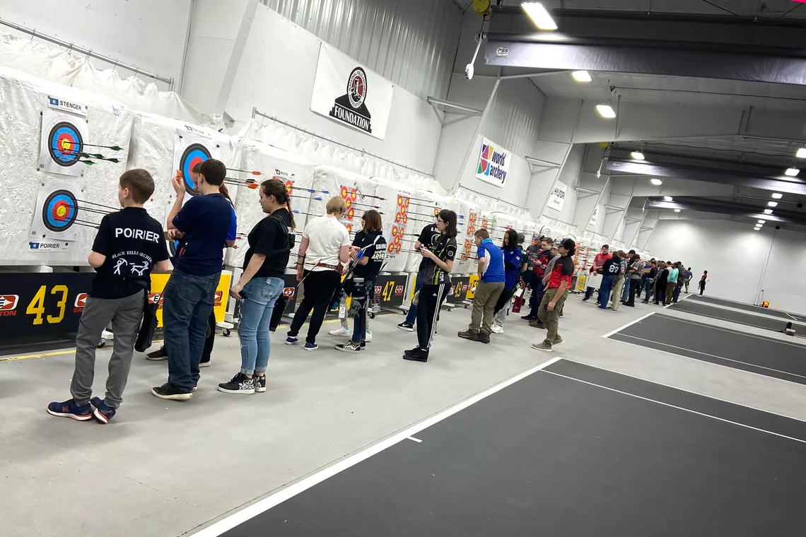 Youth archers scoring at the targets at the Rushmore Rumble in 2020.