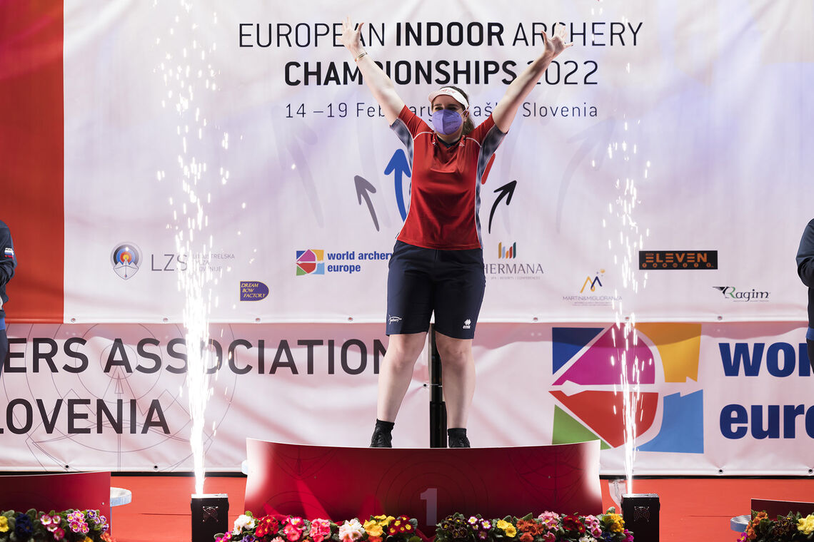 Ella Gibson on top of the podium at the 2022 Indoor Archery European Championship