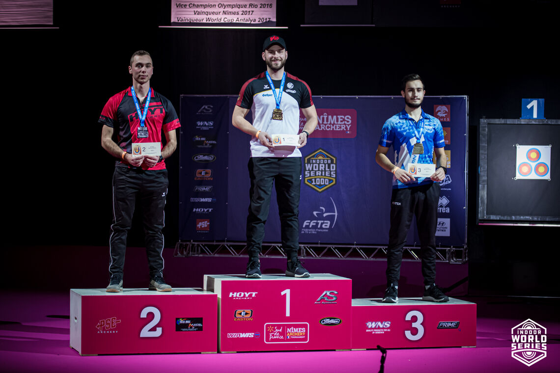 Felix Wieser stands on top of the podium at Nimes 2022