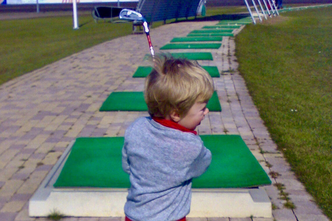 Fullerton playing golf at a young age