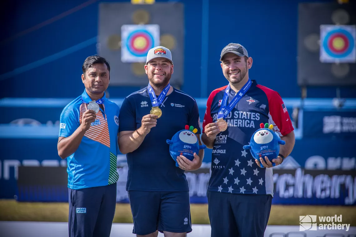 Schloesser standing at the top of the Gwangju 2022 podium