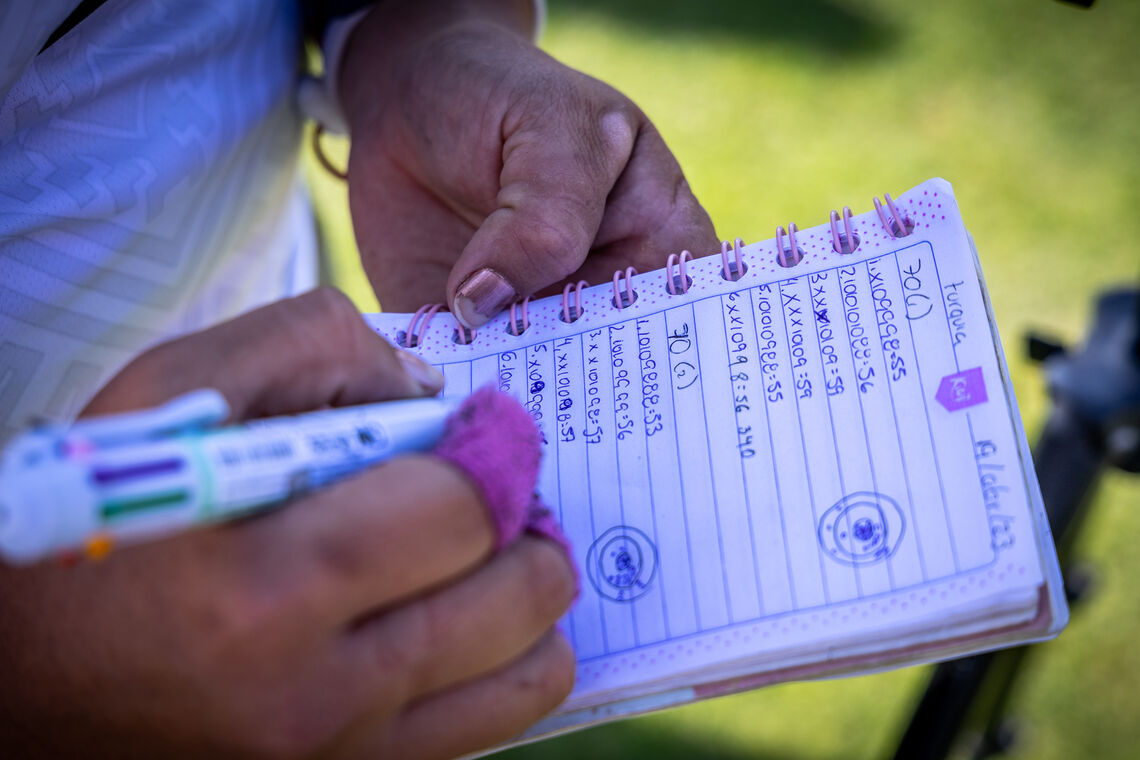 Alejandra Valencia writes her last end of qualifying in her notebook.