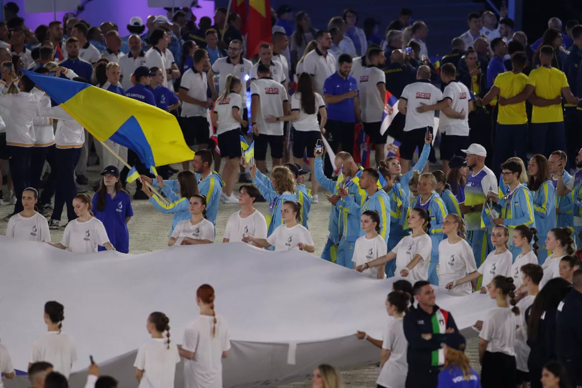 Anastasia Pavlova at the front of the Ukrainian delegation as it enters the stadium in Krakow.