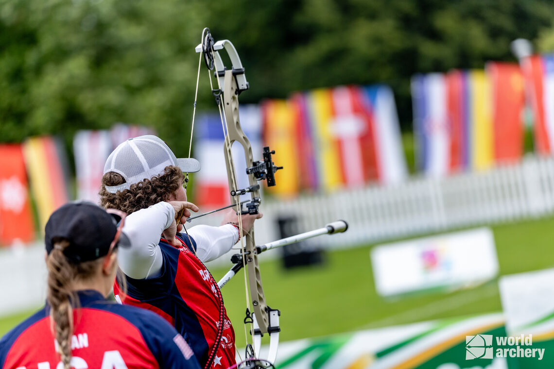 Dewey Hathaway shoots as Olivia Dean watches on in the compound under-18 mixed team final.