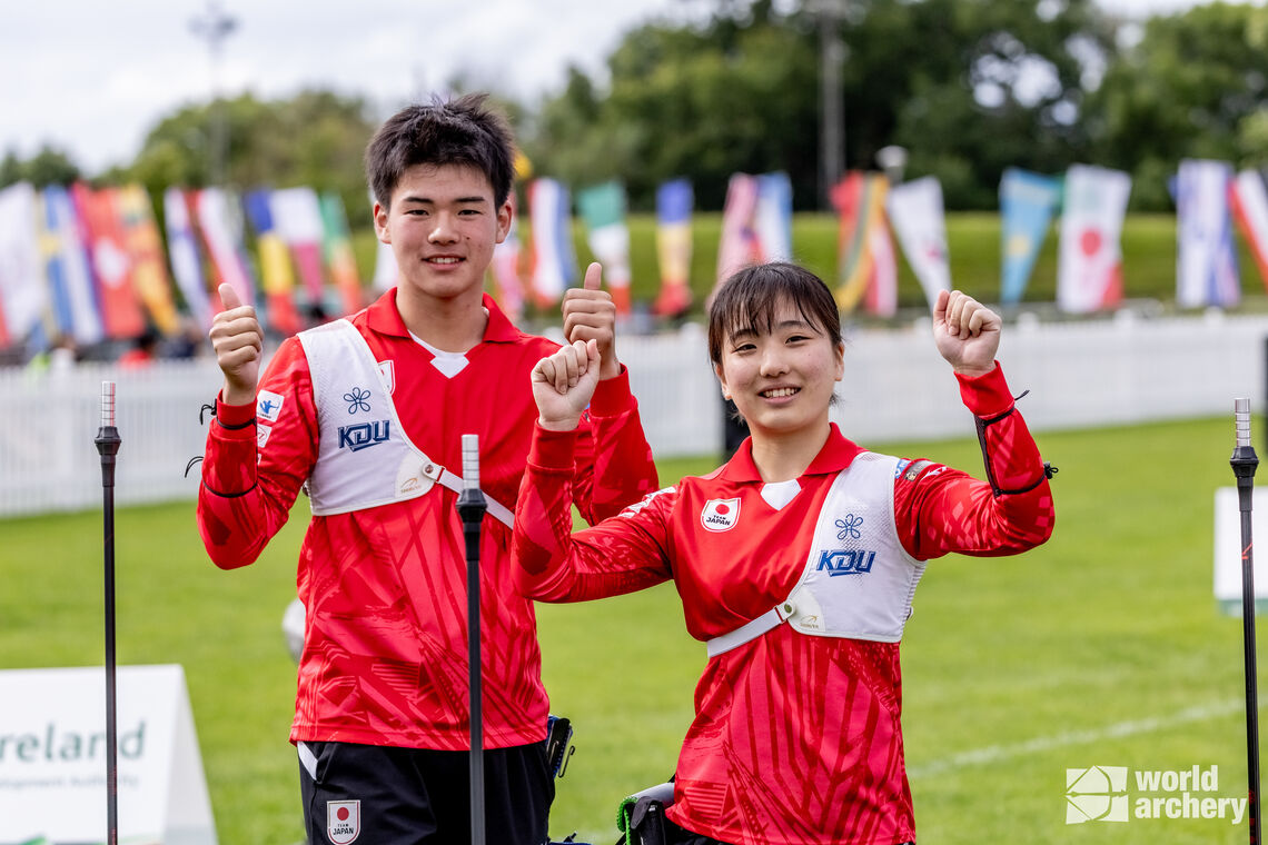 Japan’s Wada Aoi and Shirai Kosei celebrate a four-set win over the USA in the recurve under-18 mixed team final.