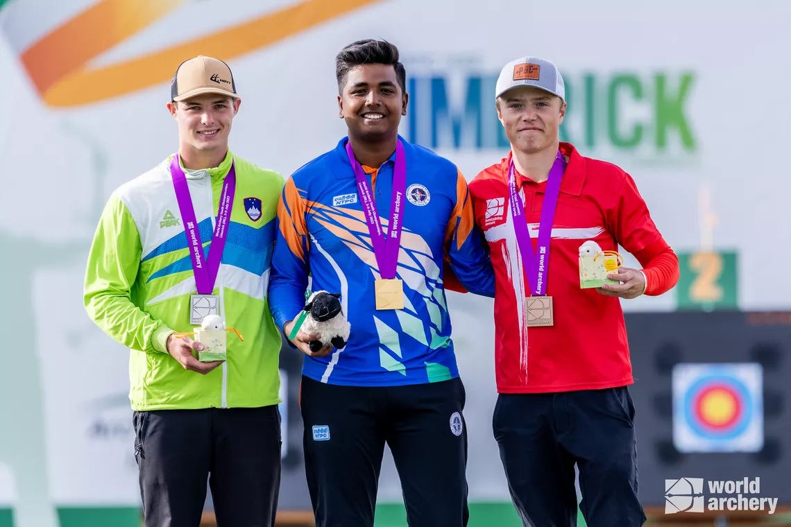 Aljaz Matija Brenk, Priyansh and Mathias Fullerton on compound under-21 men’s podium.