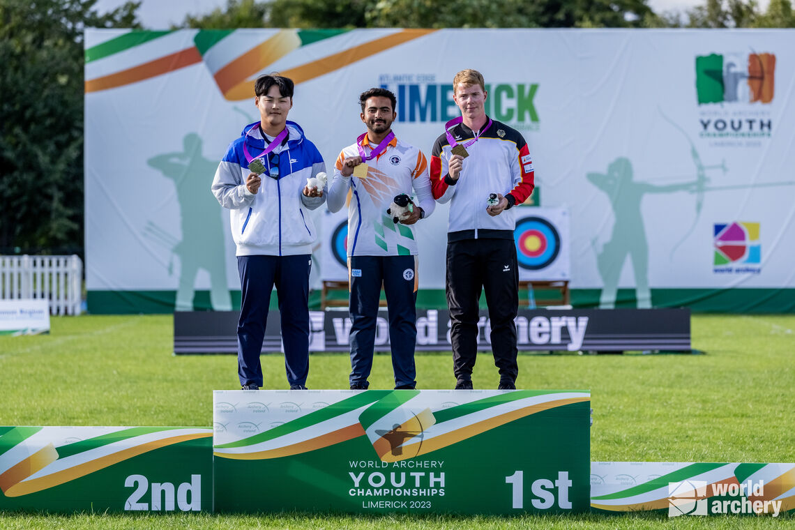 Song Injun, Parth Sushant Salunkhe and Mathias Kramer on recurve under-21 men’s podium.