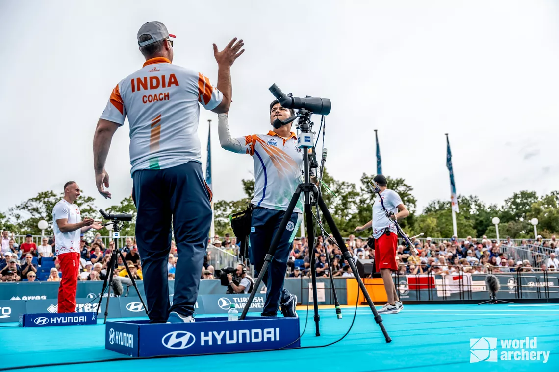 Sergio Pagni high-fives Ojas Pravin Deotale