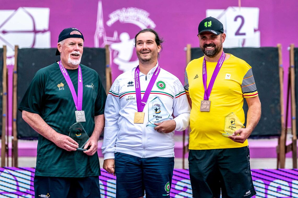 Craig Newbery celebrating silver on VI1 podium at Pilsen 2023 World Archery Para Championships.