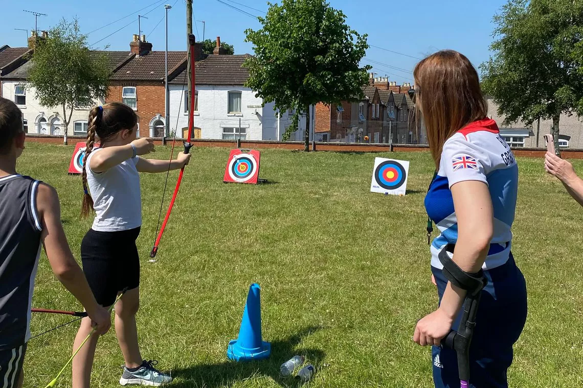 Danielle Brown teaching young archers.