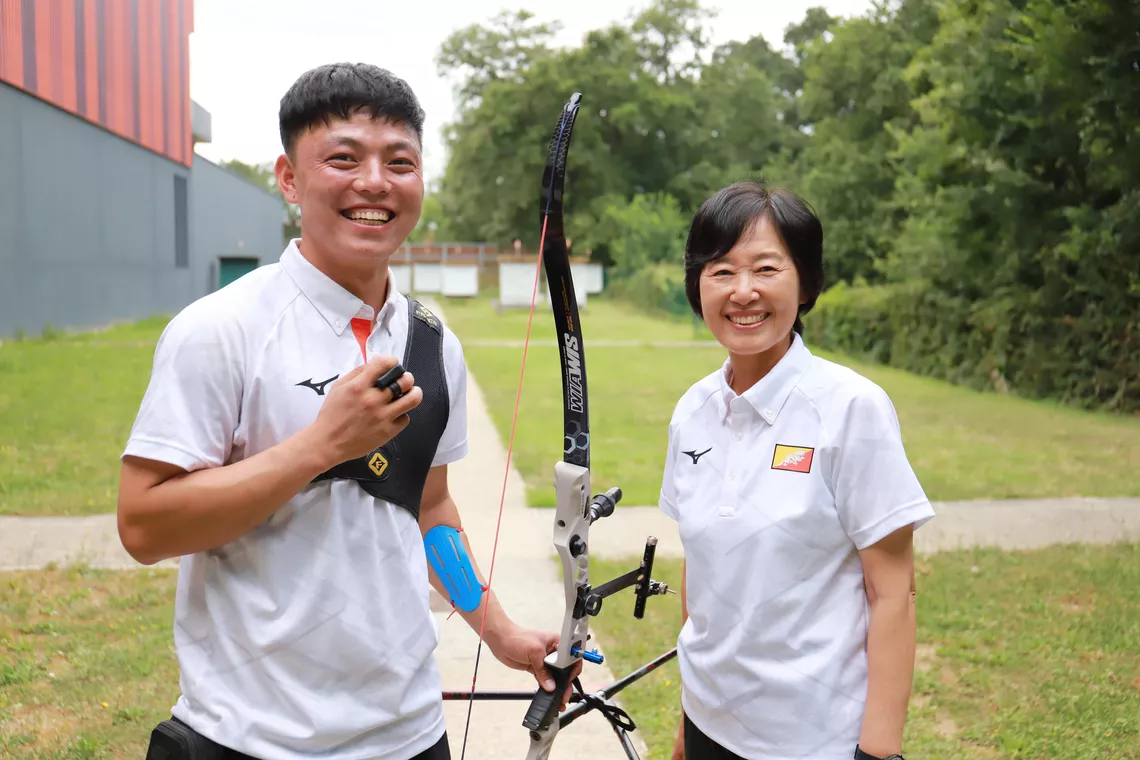 Archer with his coach