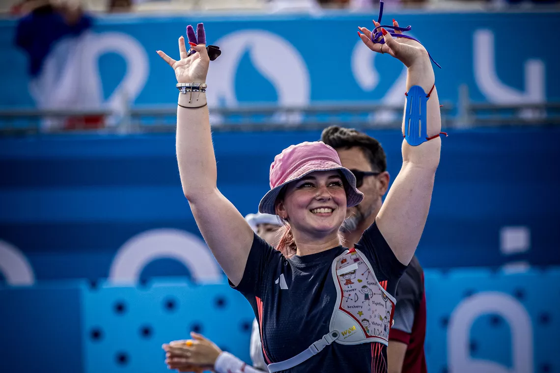 Penny Healey waving to the crowd.
