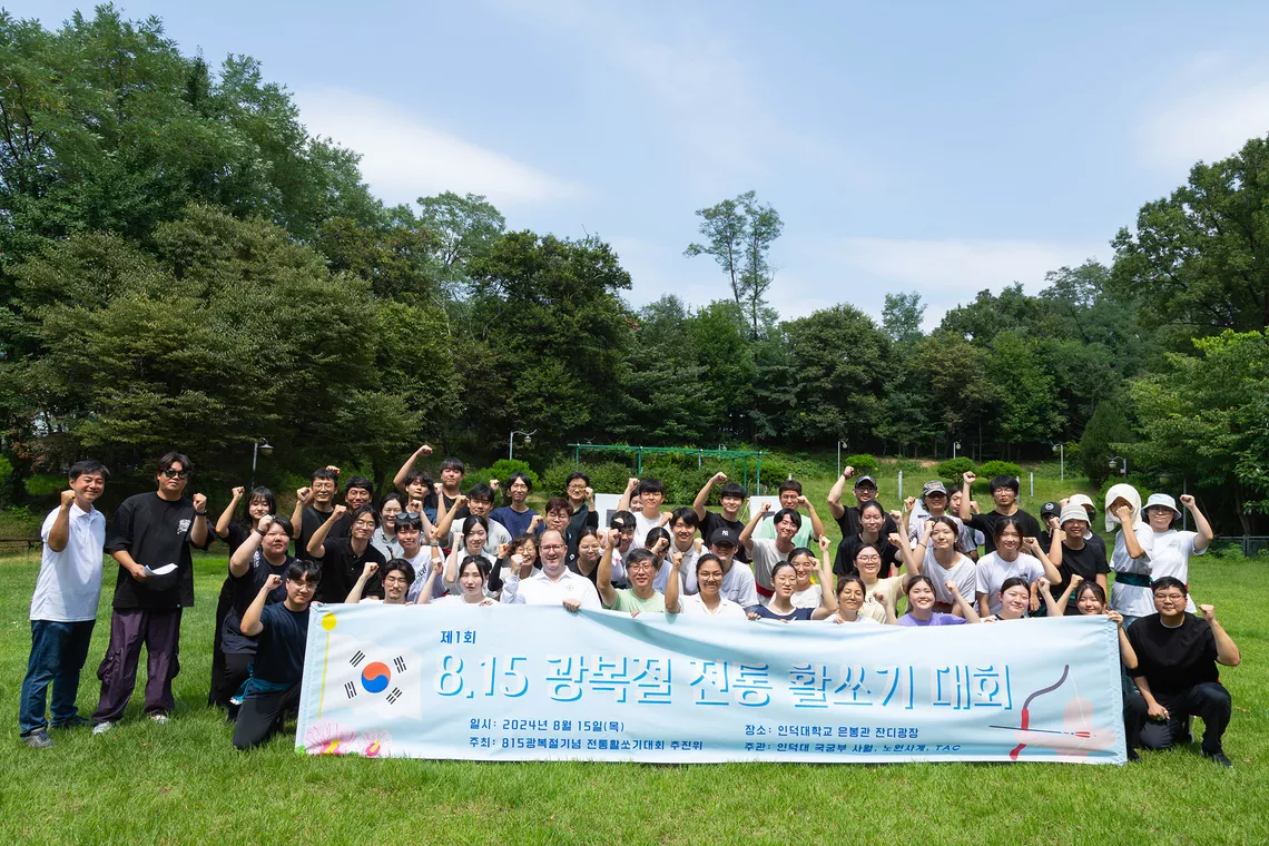 Andrew White with Korean students after the very first KTA 8:15 Liberal Commemorative competition at Induk university. 