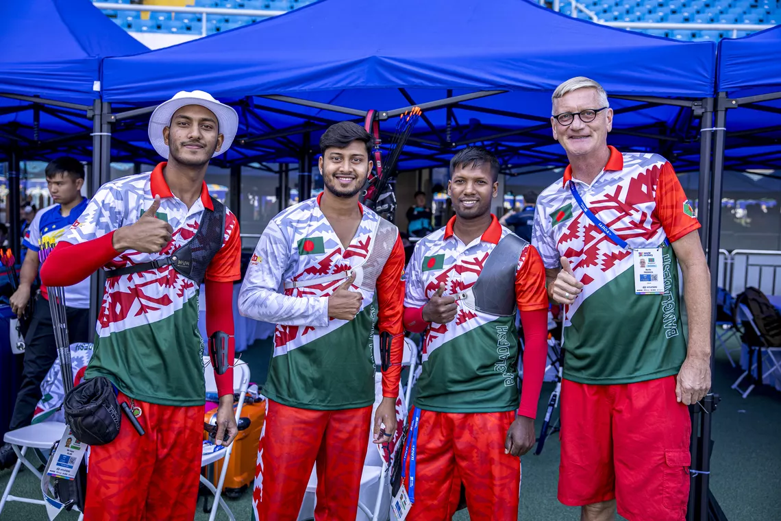 Bangladeshi recurve men's team with head coach at Shanghai 2024 Hyundai Archery World Cup.