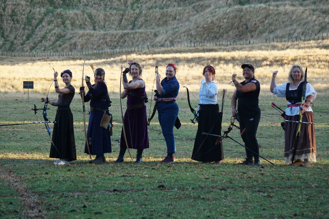 Female archers take the pose at special event in local club of Auckland.