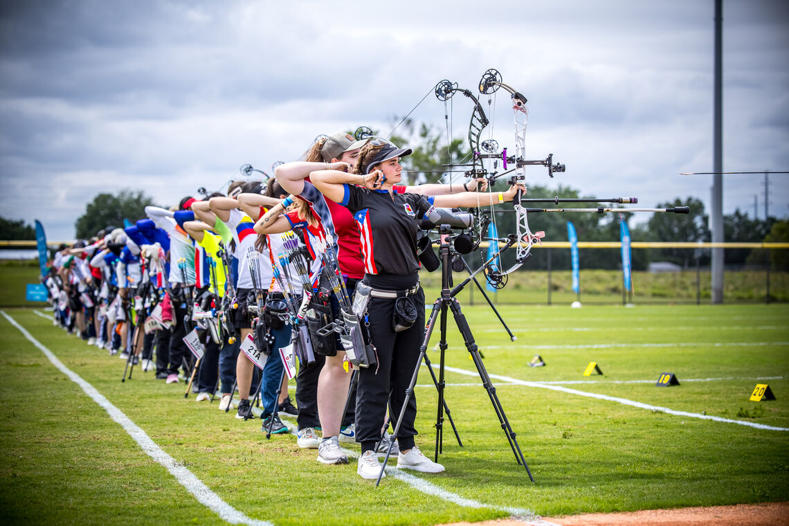 Compound women archers aiming in Auburndale.