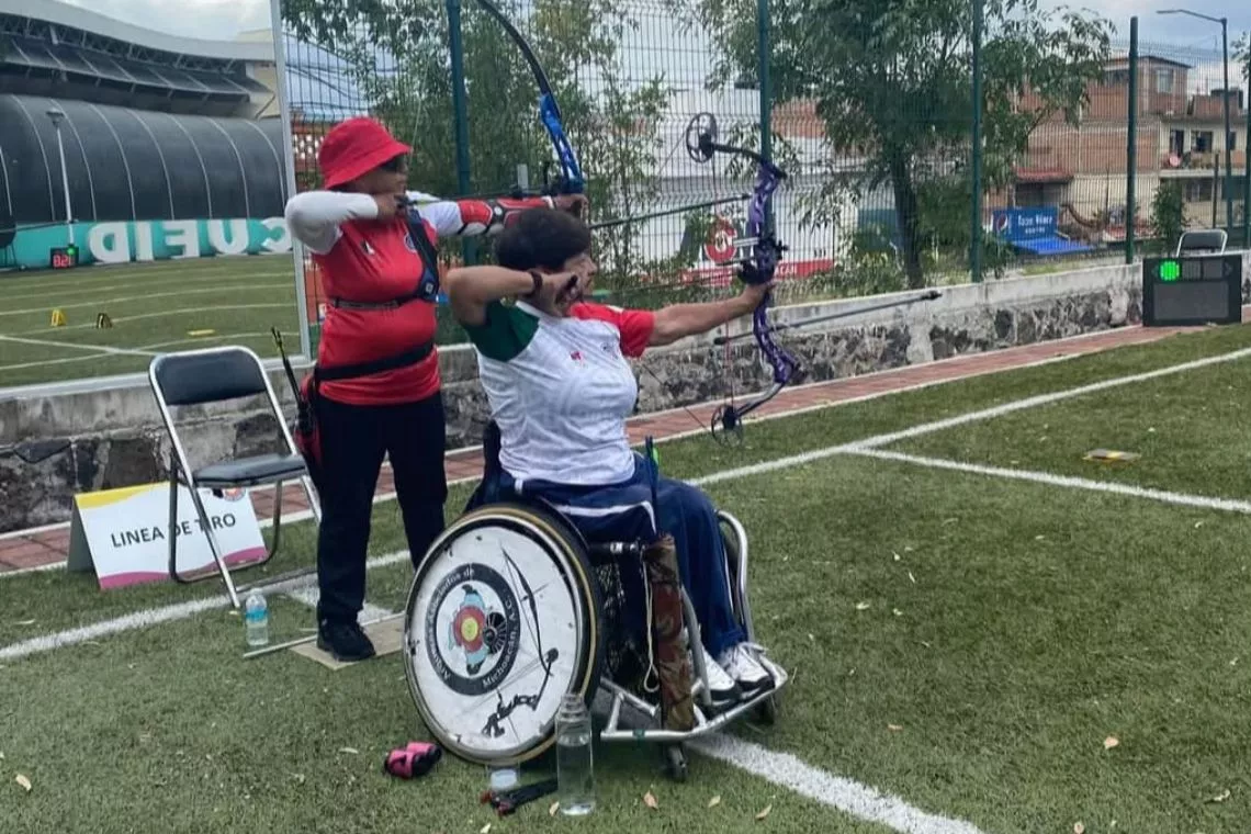 Ana Tenorio competing in a compound competition.
