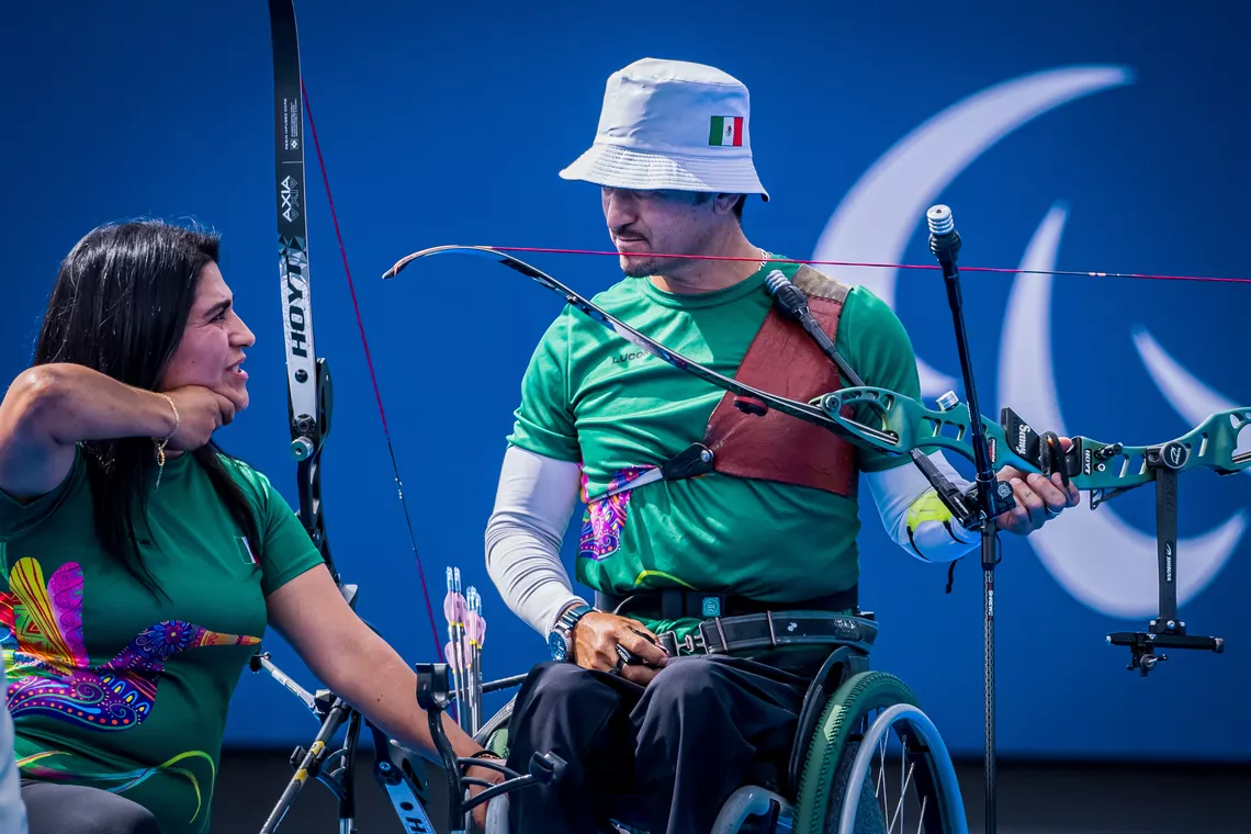 Sandra, one of Ana Tenorio's daughters, coaching Samuel Molina.