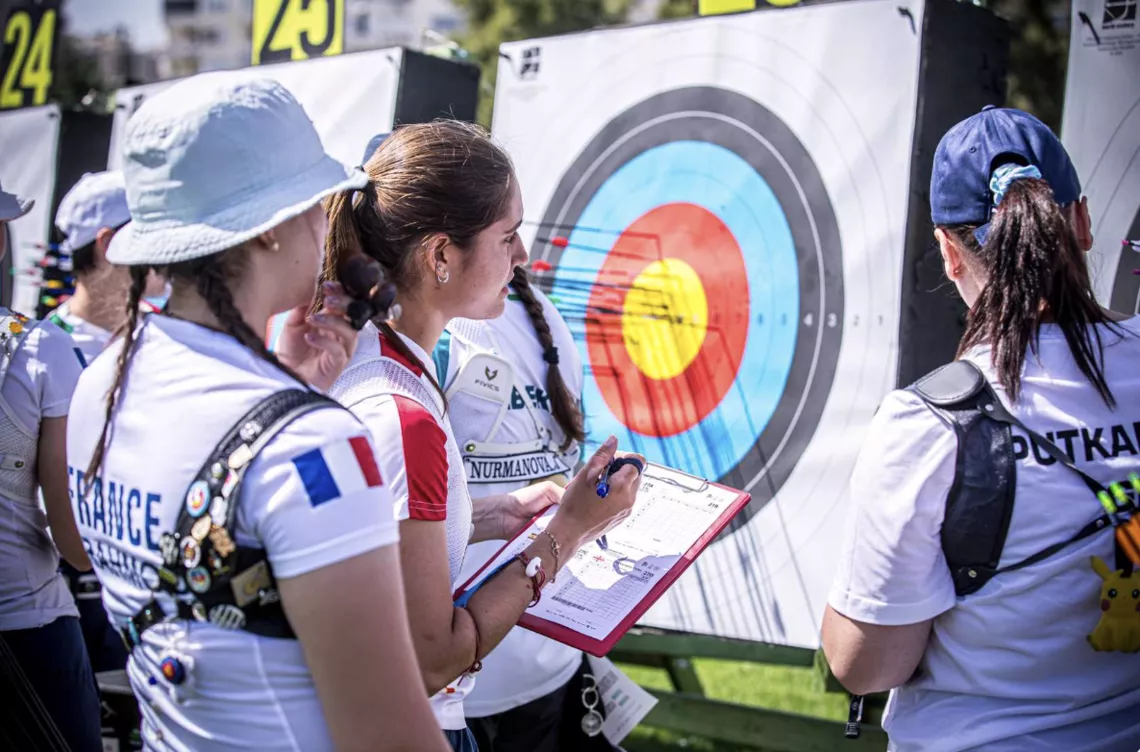 Siham Er'Rahmouni counting scores at Spring Arrows.
