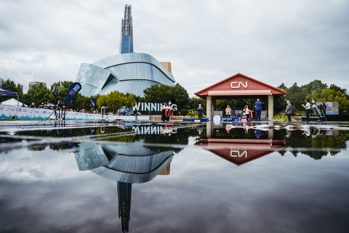 Winnipeg 2025 finals backdrop with the Canadian Museum for Human Rights towering above the field.