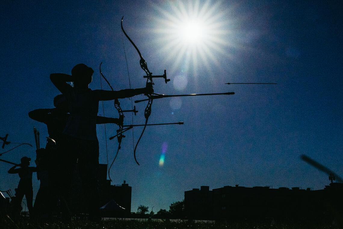 Penny Healey’s silhouette standing against the midday sun at Winnipeg 2025.
