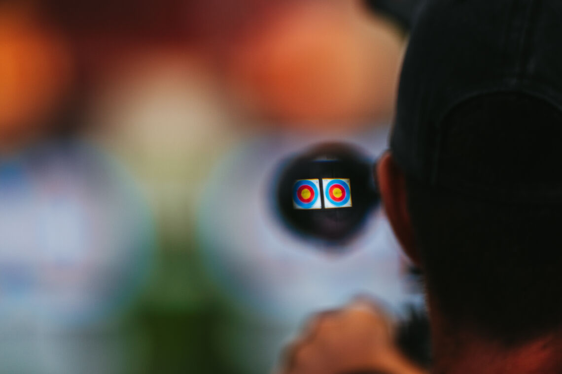 Archer aiming through sight at Winnipeg 2025.