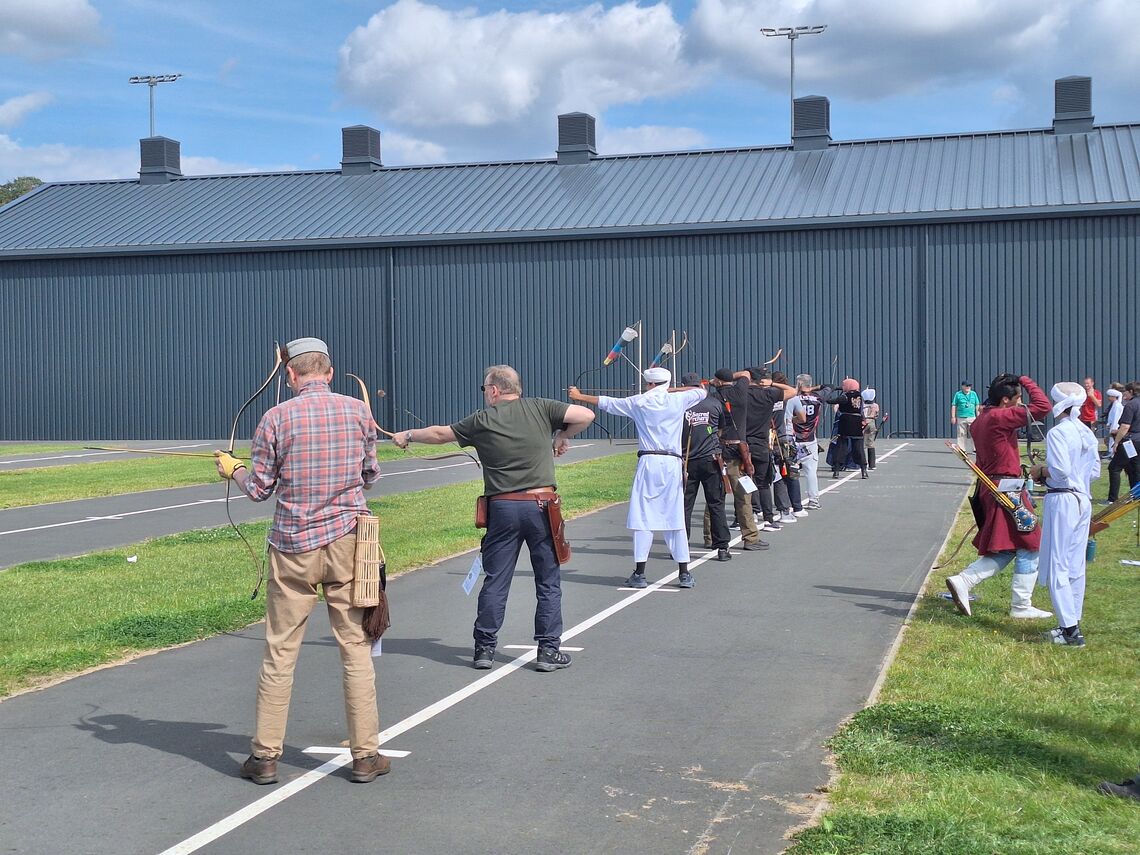 Archers aiming on the shooting line at Lilleshall.