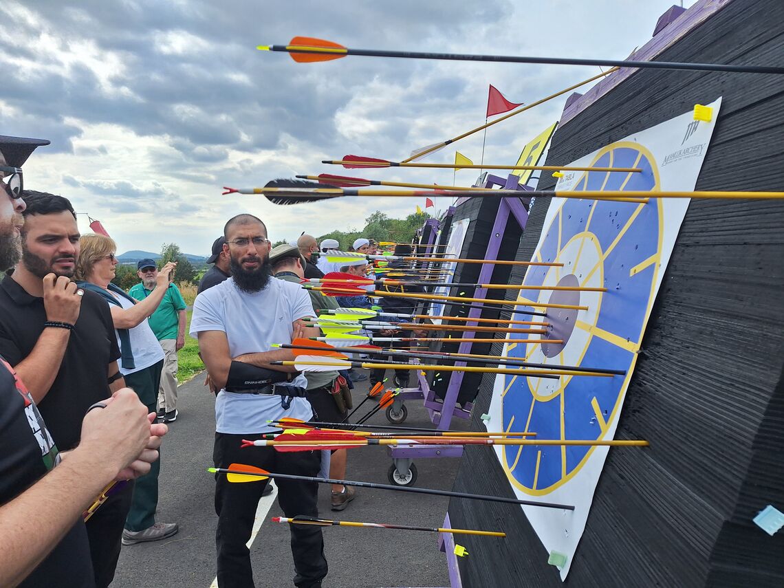 Archers at the targets counting scores.