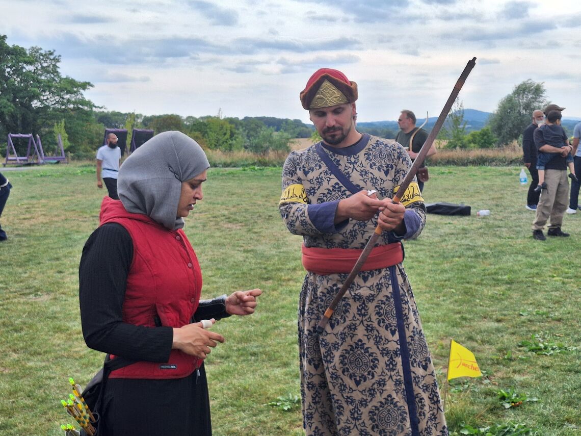 Alperen Alkan giving advice to one of the archers.