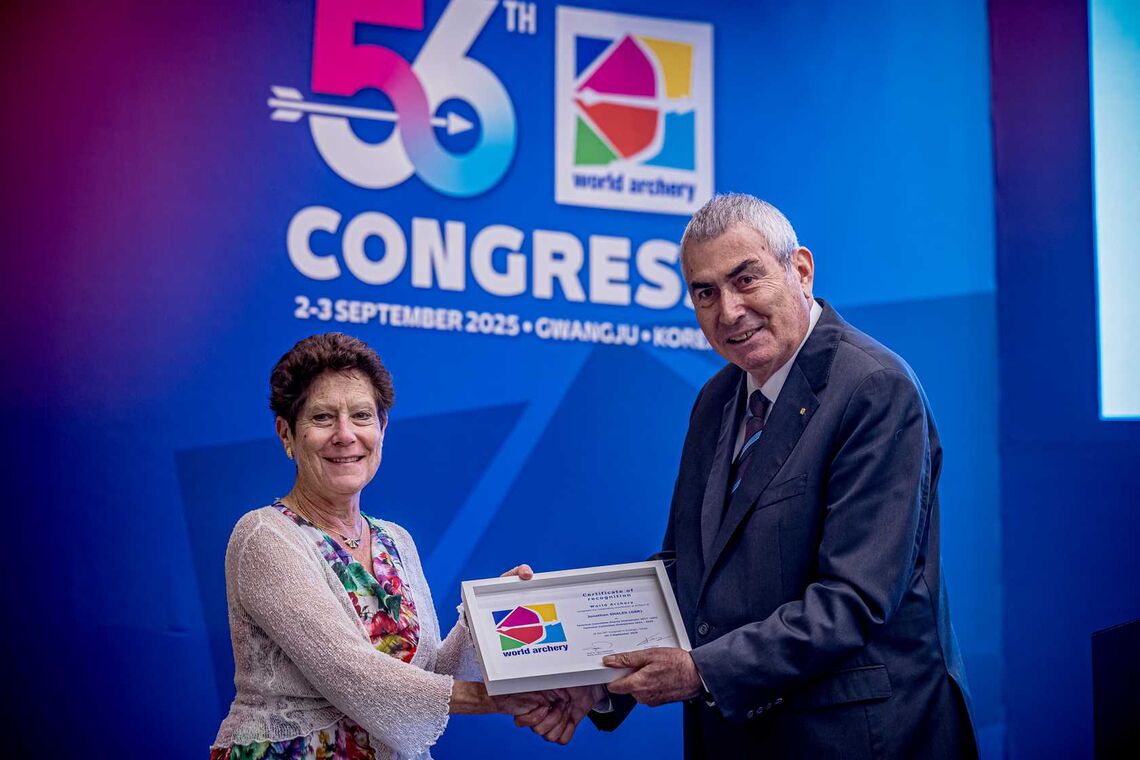 Hilda Gibson receives retiring official honour from Prof Dr Ugur Erdener for years of service.