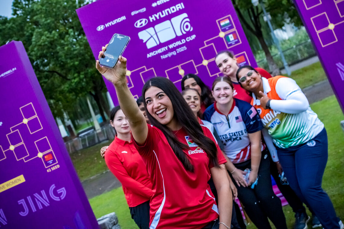 Mariana Bernal taking a selfie of her and fellow compound women finalists.