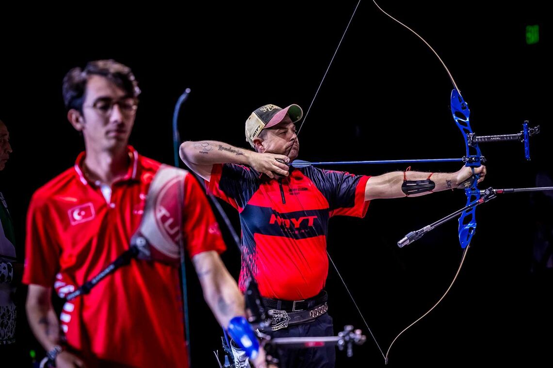 Brady Ellison and Mete Gazoz shooting at Indoor Archery World Series Finals.