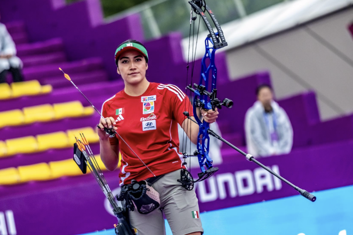 Mariana Bernal looking on.