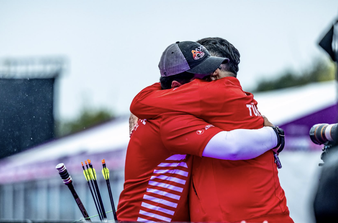 Haney hugging his coach after beating Mathias Fullerton.