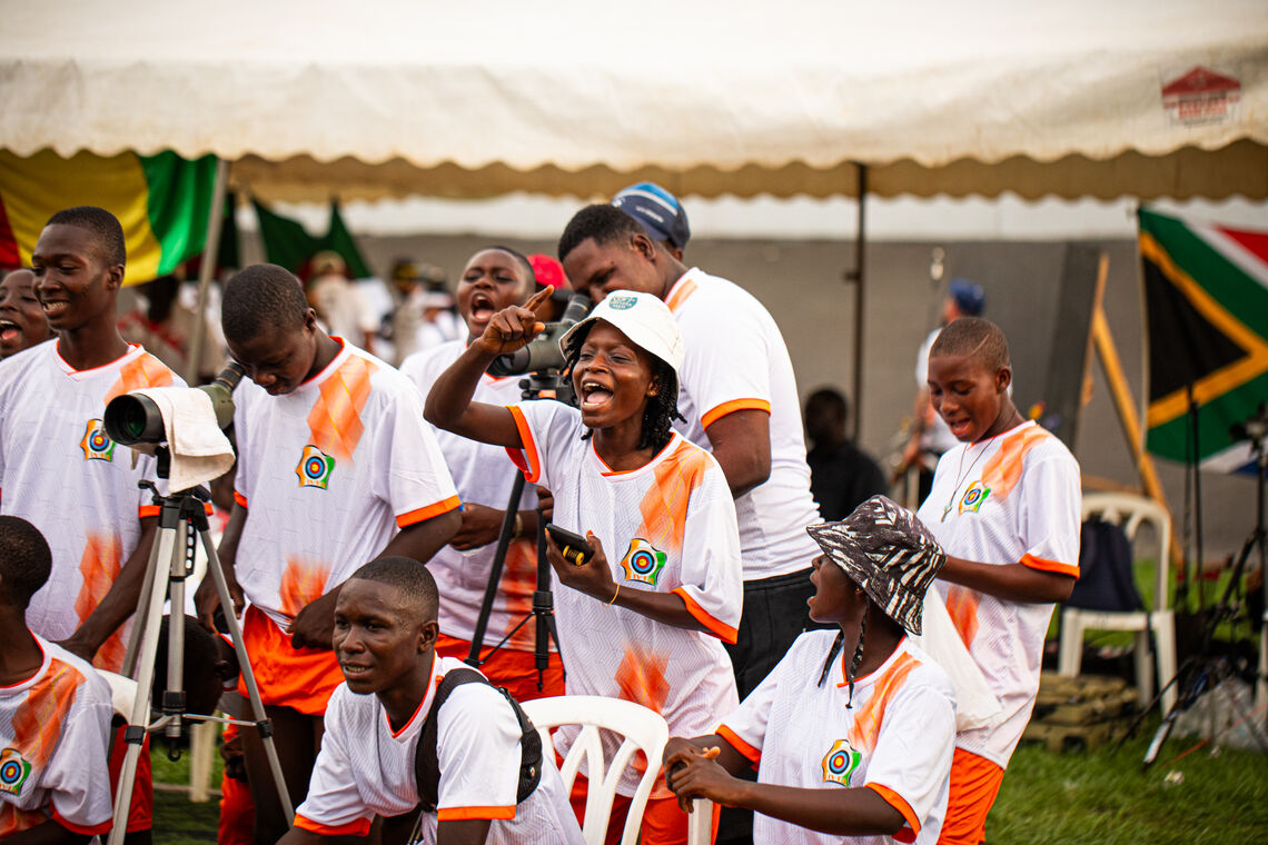 Ivorian archers cheering for teammate Franck Eyeni. 