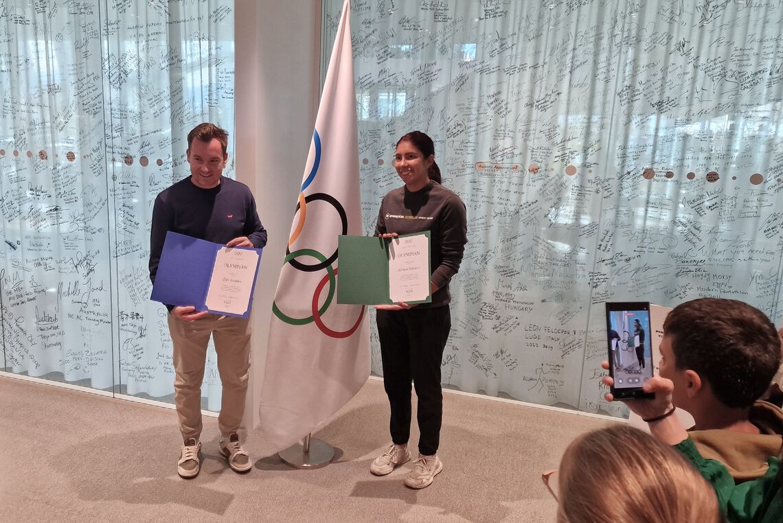 Ziga Ravnikar and Adriana Espinoza de los Monteros signed the Olympians’ Wall at the Olympic House.