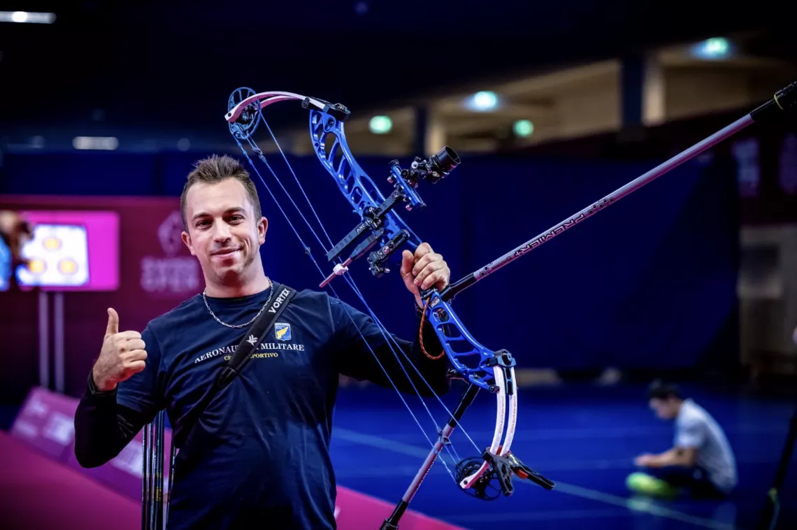 Marco Morello celebrating by lifting his bow.