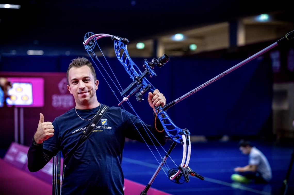 Marco Morello celebrating by lifting his bow.