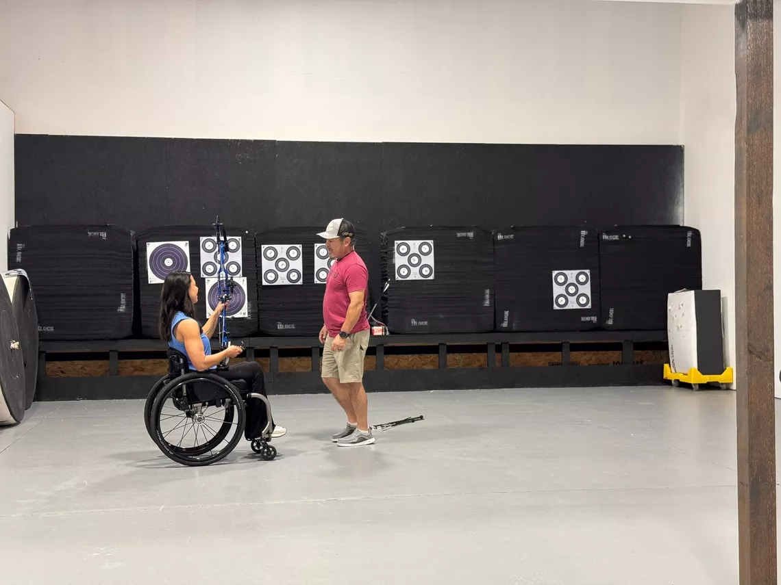 A one-to-one training session happening with an archer.
