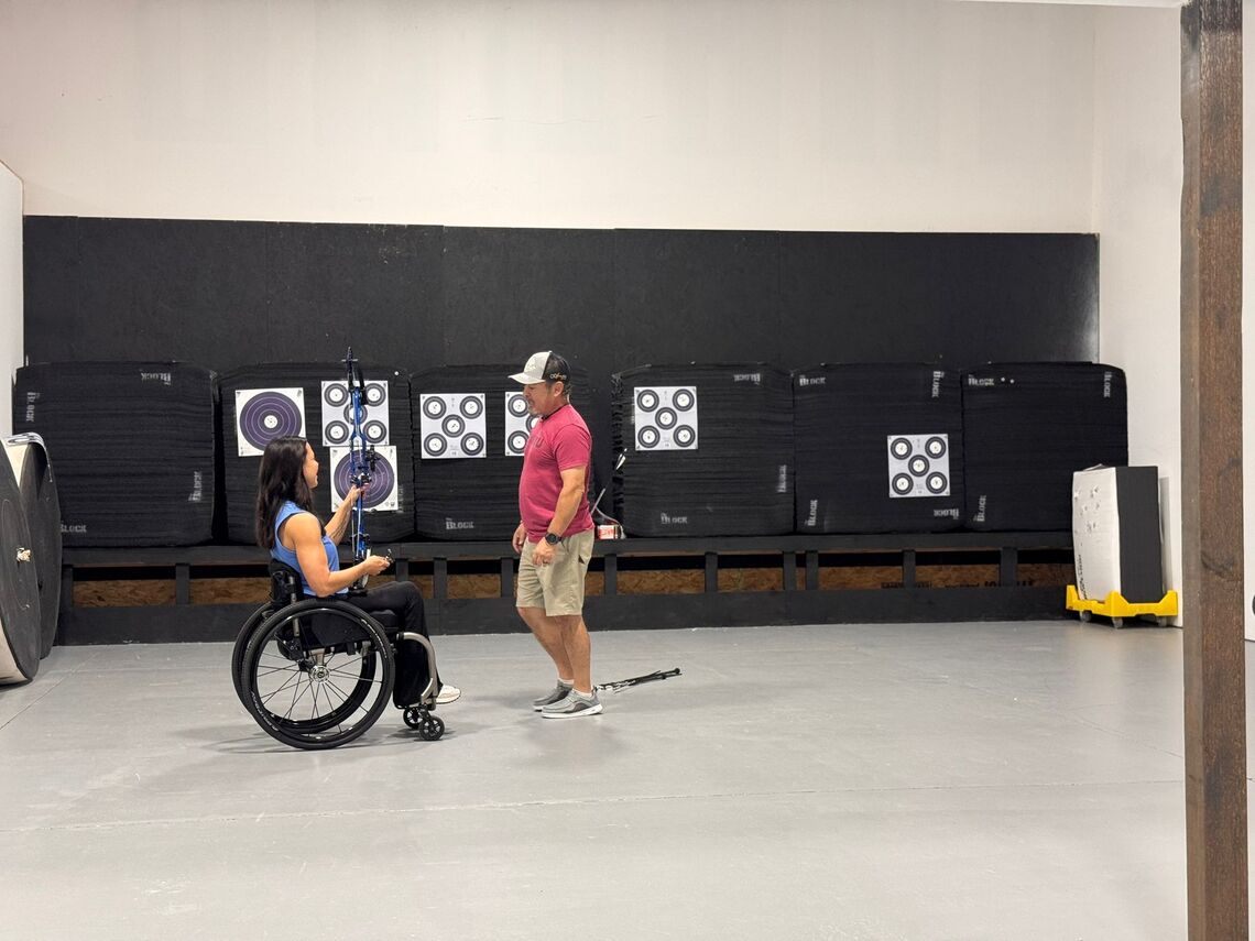 A one-to-one training session happening with an archer.