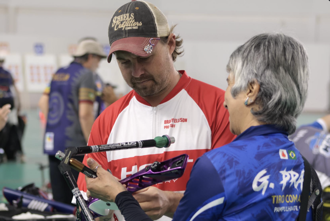 Brady Ellison getting his equipment checked.